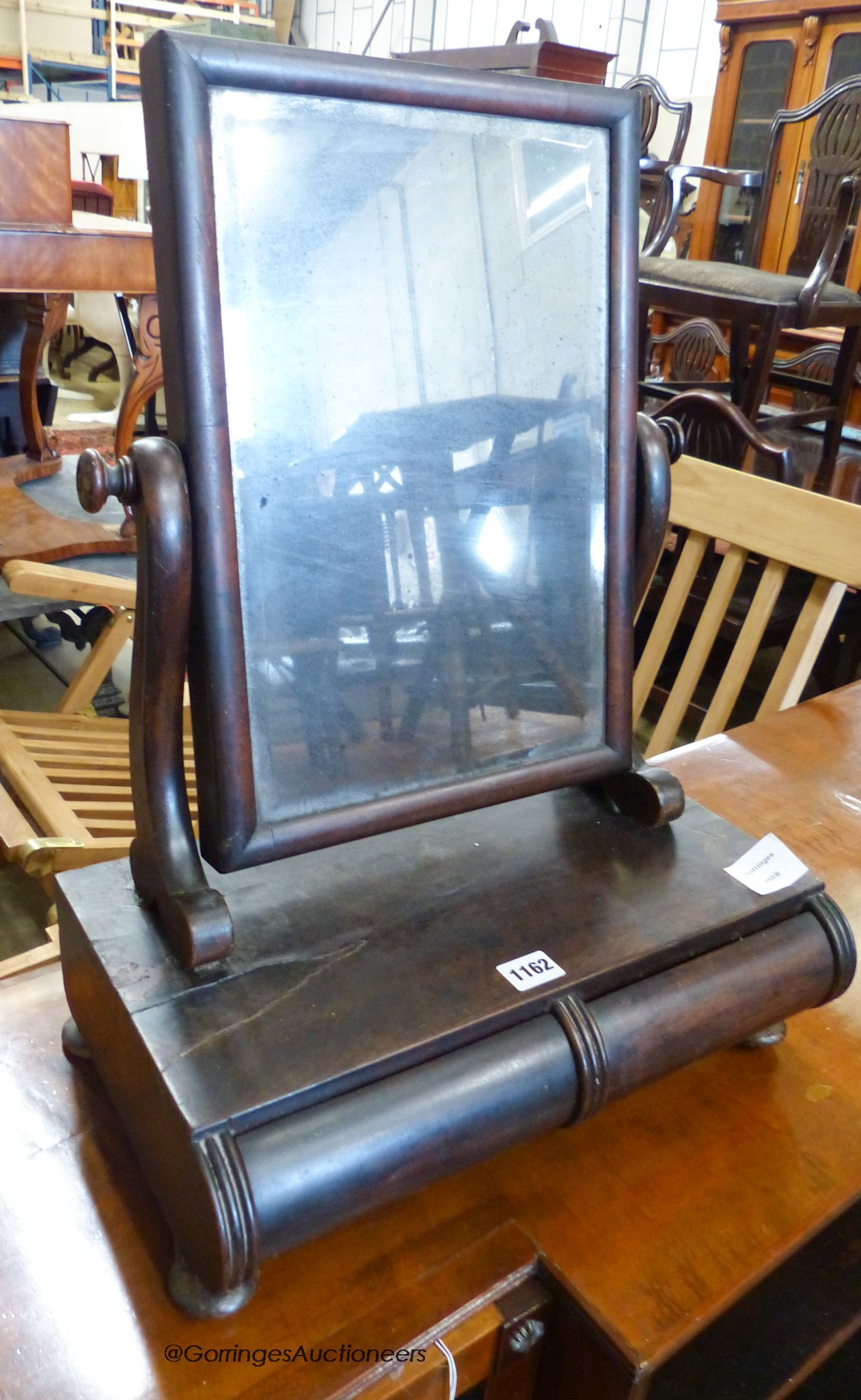An early mahogany Victorian toilet mirror. W-41, H-56.